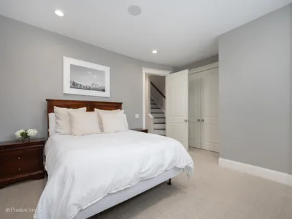 a bedroom with a bed and a walk in closet