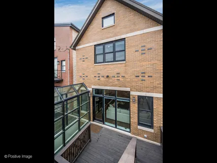 a view of a house with a door and balcony