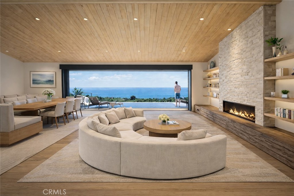 29675 Cuthbert Road Malibu, CA 90265 - Photo 4 of 7 a living room with furniture and a fireplace