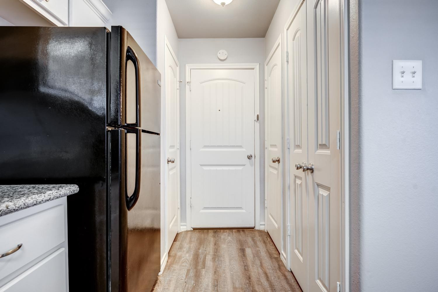 3450 Itasca Street Lubbock, TX 79415 - Photo 12 of 24 a view of a hallway with wooden floor and staircase