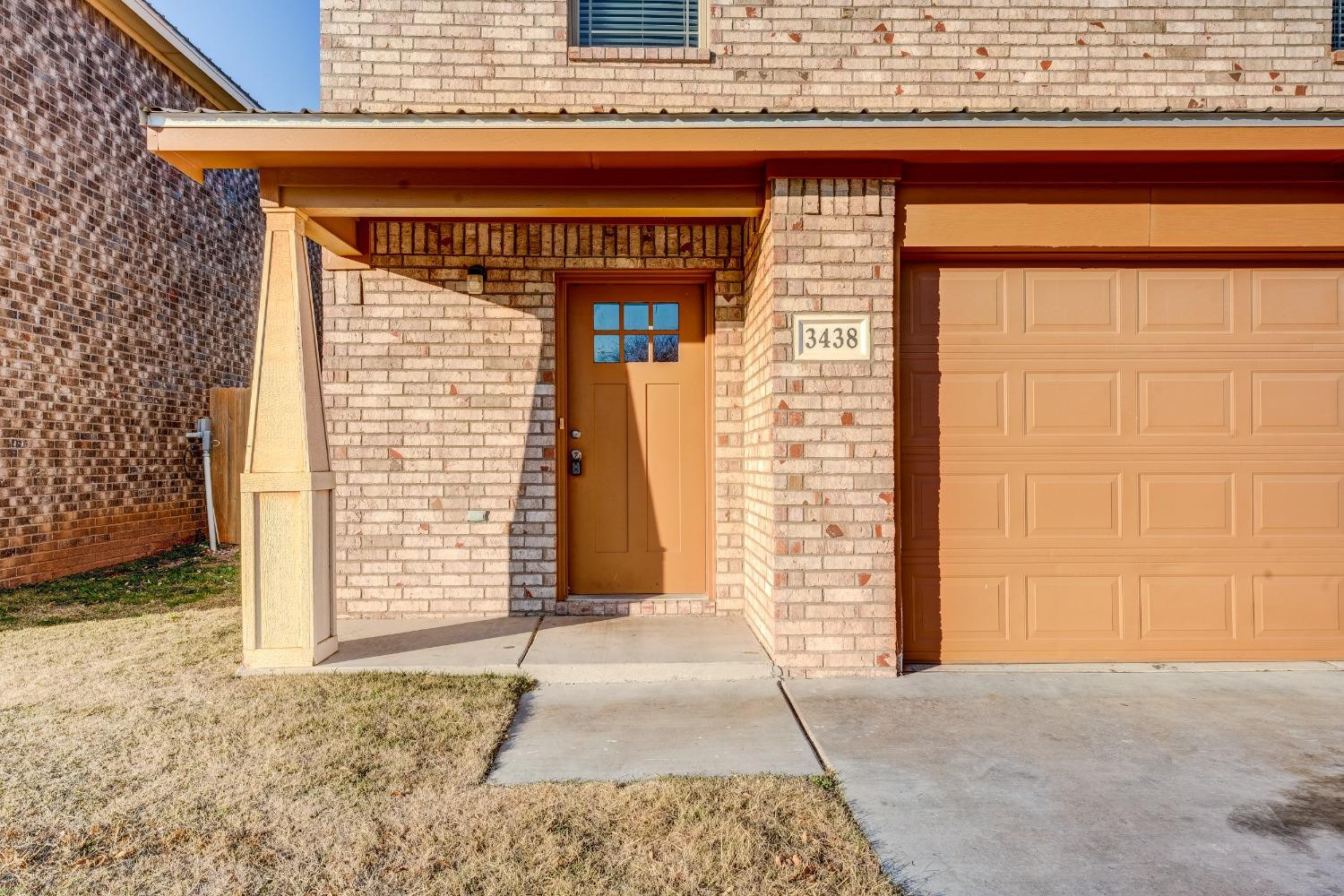 3450 Itasca Street Lubbock, TX 79415 - Photo 2 of 24 a front view of a house with a garage