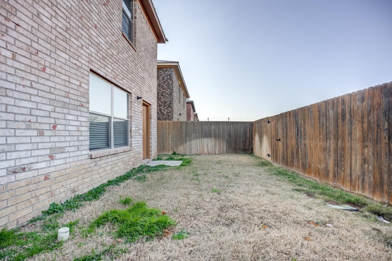 3450 Itasca Street Lubbock, TX 79415 - Photo 23 of 24 a backyard of a house