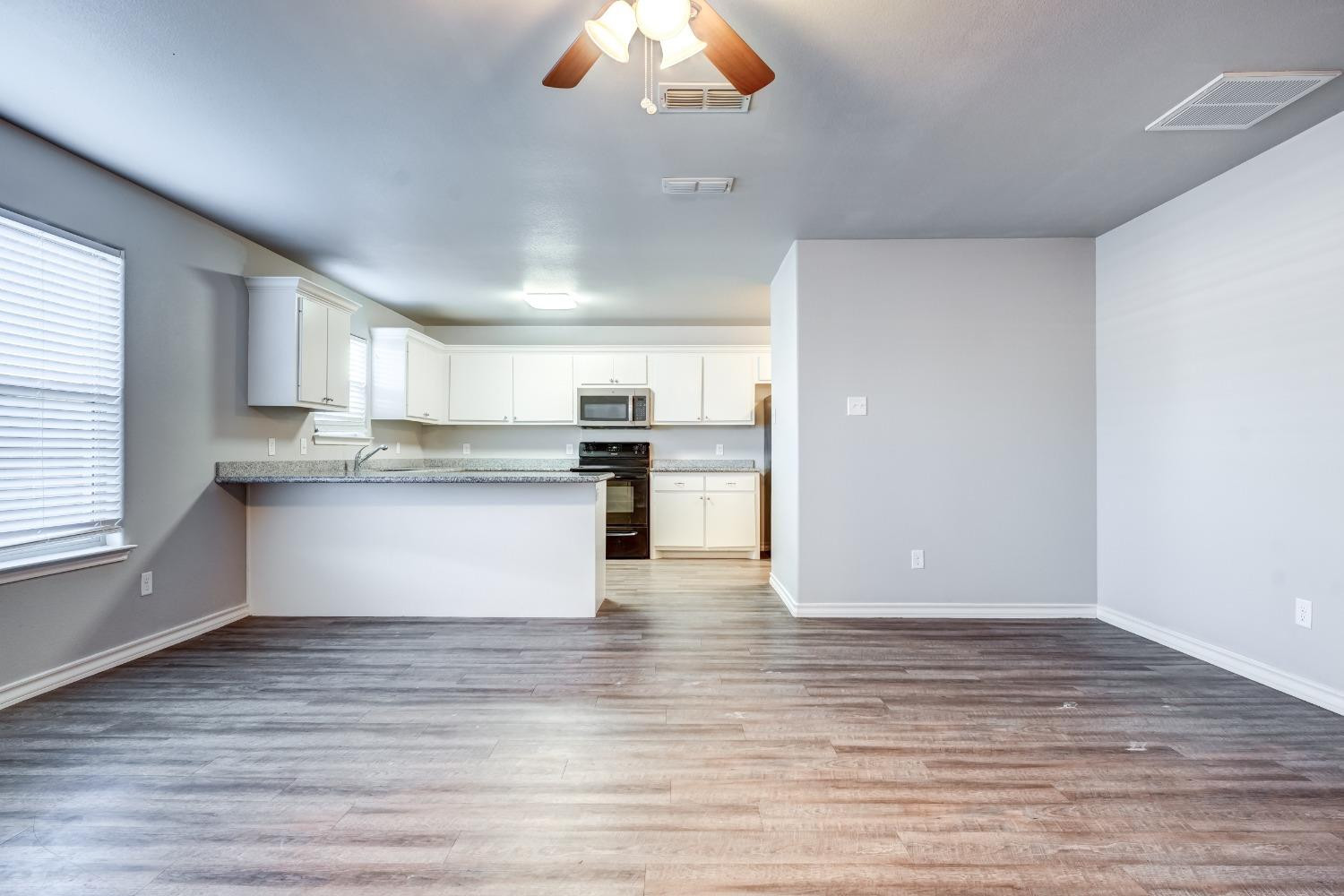3450 Itasca Street Lubbock, TX 79415 - Photo 5 of 24 a view of kitchen with granite countertop cabinets and refrigerator