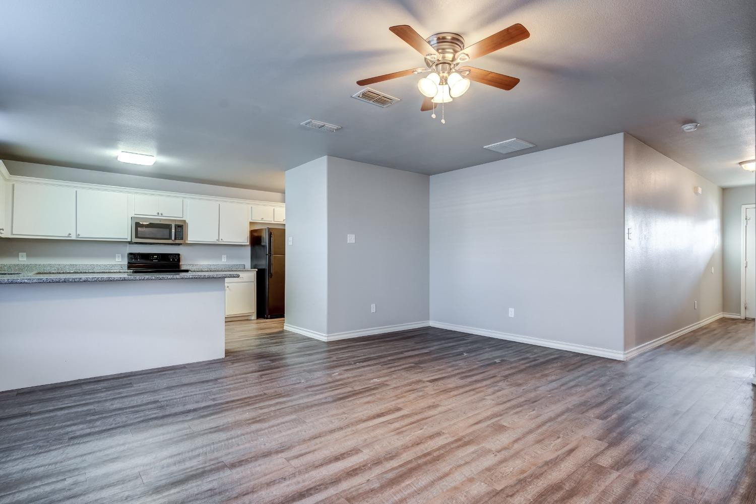 3450 Itasca Street Lubbock, TX 79415 - Photo 6 of 24 a view of kitchen with stainless steel appliances granite countertop a refrigerator and a stove