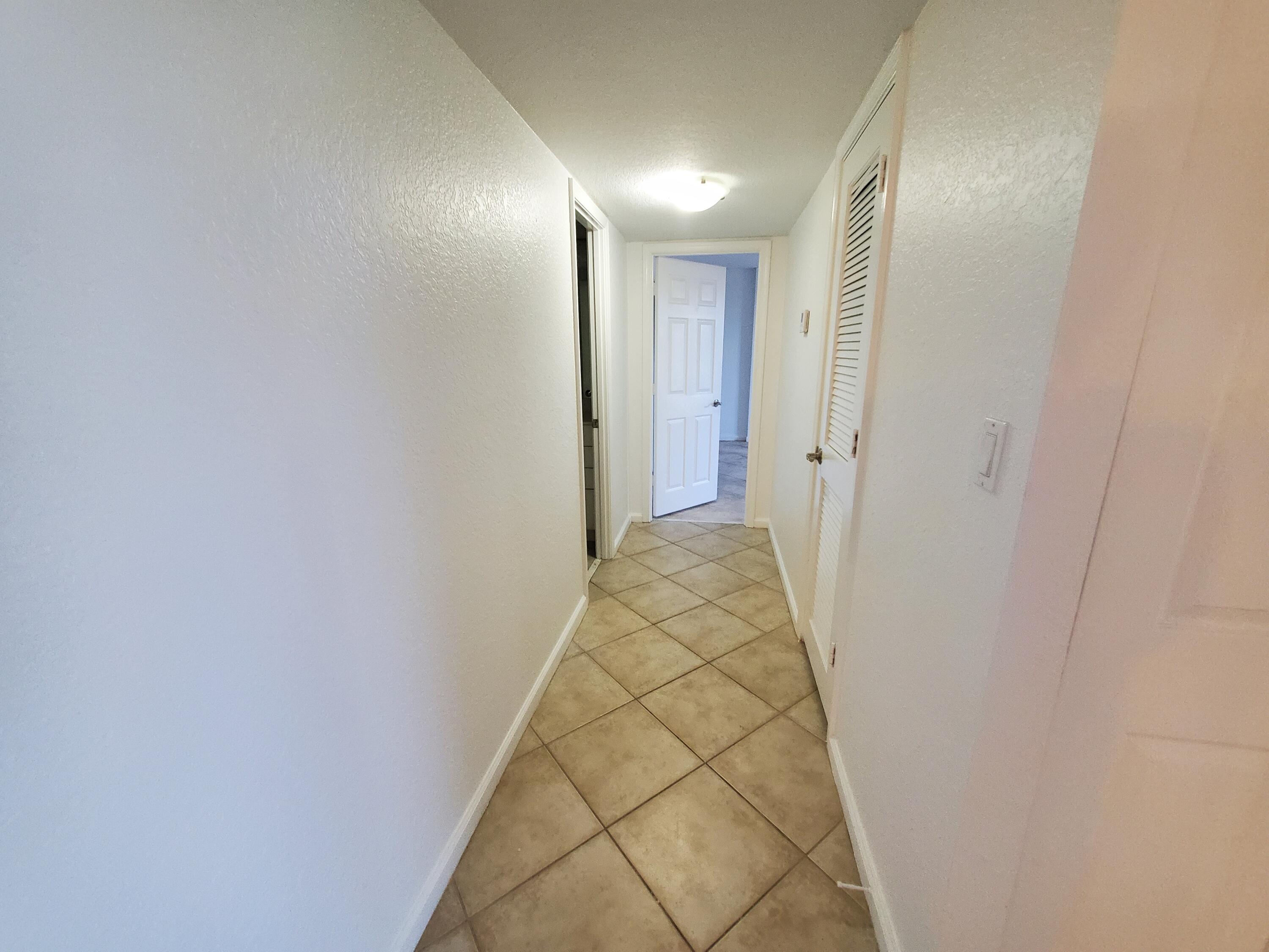 1000 Spanish River Road, Unit 4K Boca Raton, FL 33432 - Photo 10 of 22 hallway to master