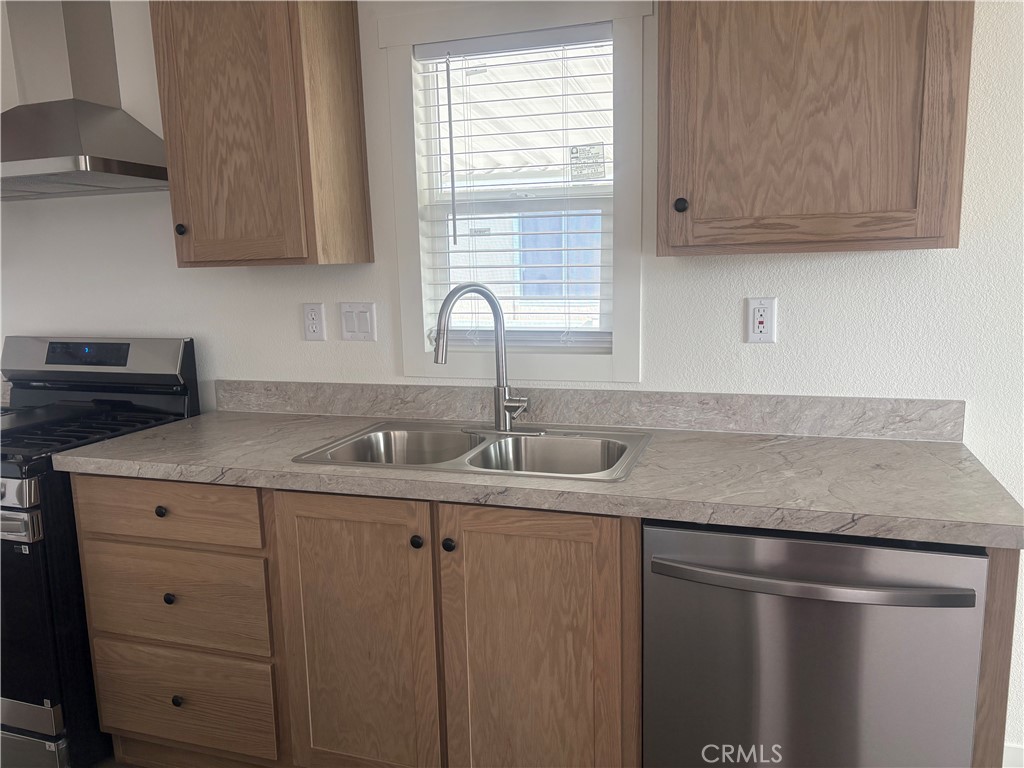 4361 Mission Boulevard, Unit 151 Montclair, CA 91763 - Photo 15 of 39 a kitchen with a sink and cabinets