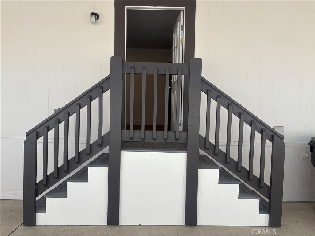 4361 Mission Boulevard, Unit 151 Montclair, CA 91763 - Photo 20 of 39 a view of staircase with lots of frames on wall and a window