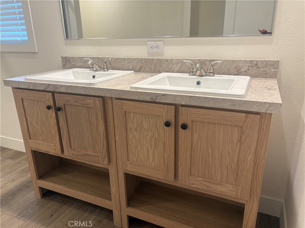 4361 Mission Boulevard, Unit 151 Montclair, CA 91763 - Photo 22 of 39 a bathroom with a sink and a mirror