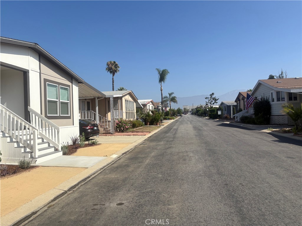 4361 Mission Boulevard, Unit 151 Montclair, CA 91763 - Photo 35 of 39 a view of a street with a building in the background