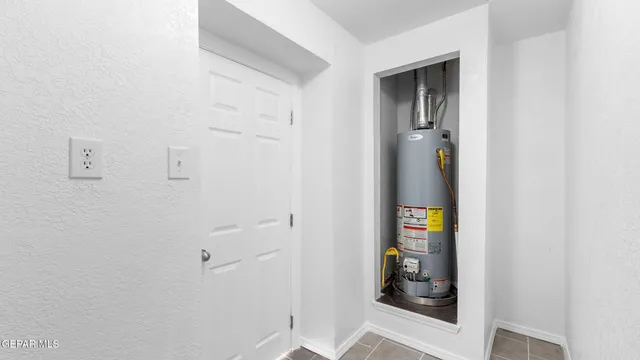 an empty room with a mirror