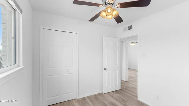 an aerial view of a house with a backyard