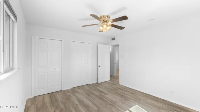 an aerial view of residential house and sandy dunes