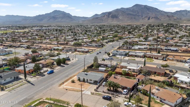 an aerial view of residential houses with city view