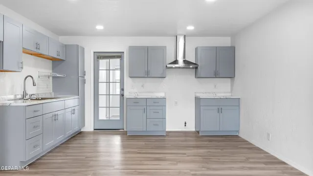 a kitchen with stainless steel appliances cabinets a sink and a stove