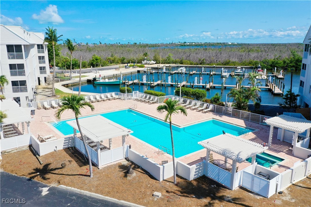 5232 Bayside Villas Captiva, FL 33924 - Photo 14 of 29 a view of a patio with swimming pool table and chairs