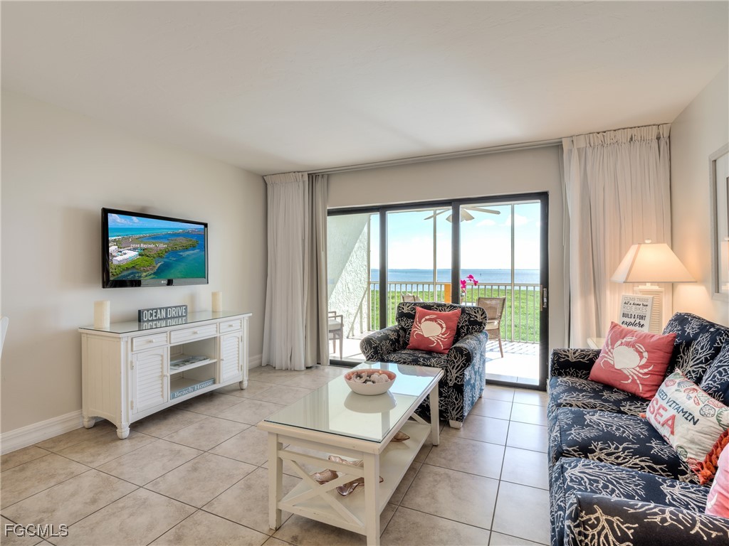 5232 Bayside Villas Captiva, FL 33924 - Photo 6 of 29 a living room with furniture and a flat screen tv