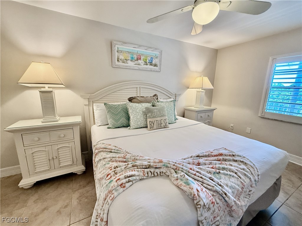 5232 Bayside Villas Captiva, FL 33924 - Photo 10 of 29 a bedroom with a bed and a night stand
