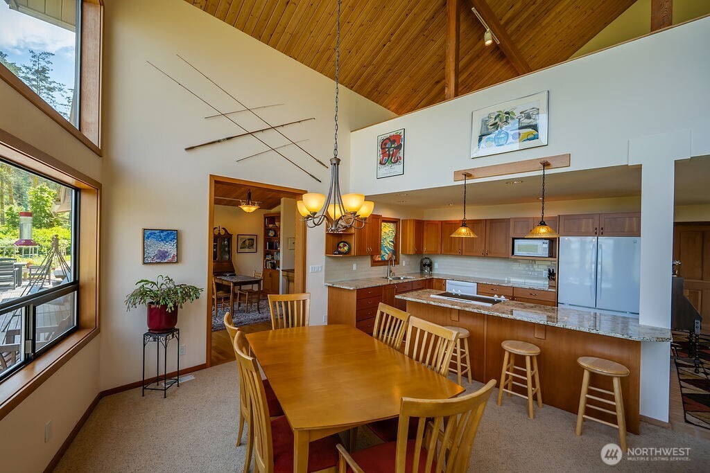 3757 Mud Bay Road Lopez Island, WA 98261 - Photo 9 of 40 a view of a dining room with furniture window and outside view