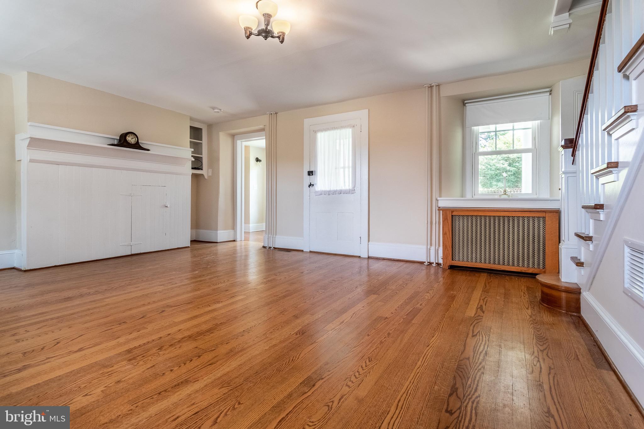 110 Lyndell Road Downingtown, PA 19335 - Photo 4 of 37 an empty room with wooden floor and windows