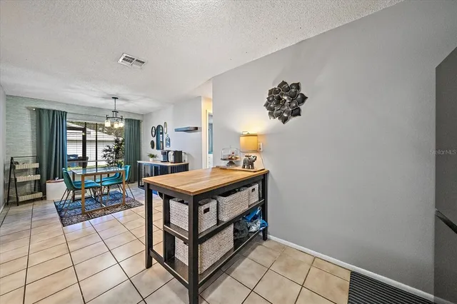 a room with pool table and window