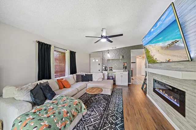 a living room with furniture and a fireplace
