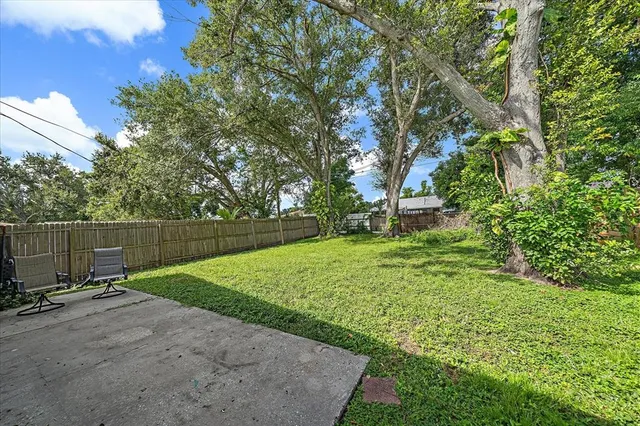 a view of a backyard with a small cabin