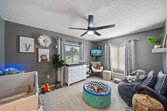 a living room with furniture and a table