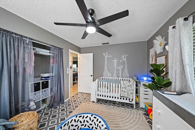 a bedroom with furniture and a window
