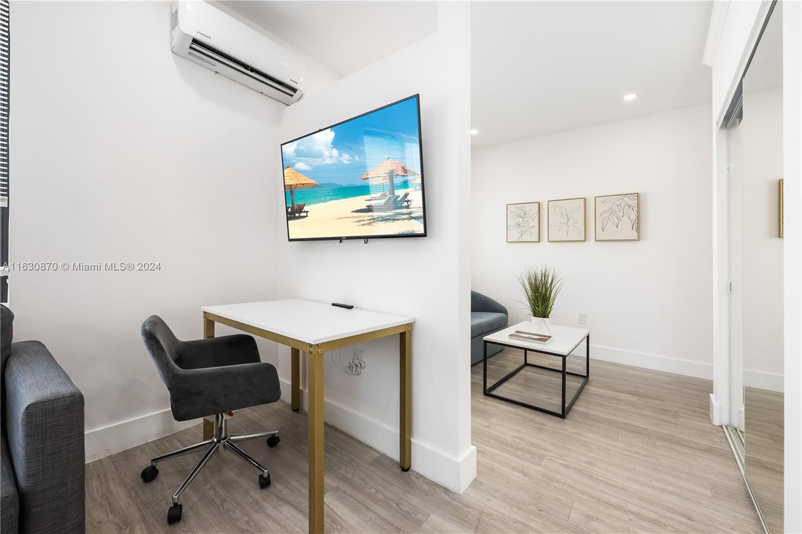 1648 Southwest 7th Street Miami, FL 33135 - Photo 11 of 23 a view of workspace with wooden floor and furniture