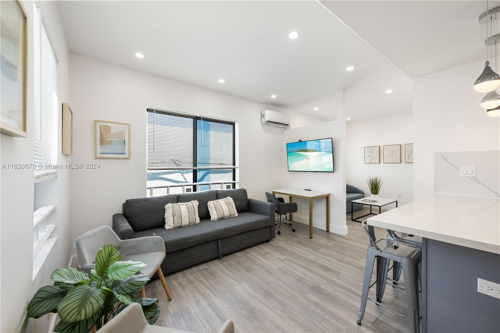 1648 Southwest 7th Street Miami, FL 33135 - Photo 12 of 23 a living room with furniture and a wooden floor