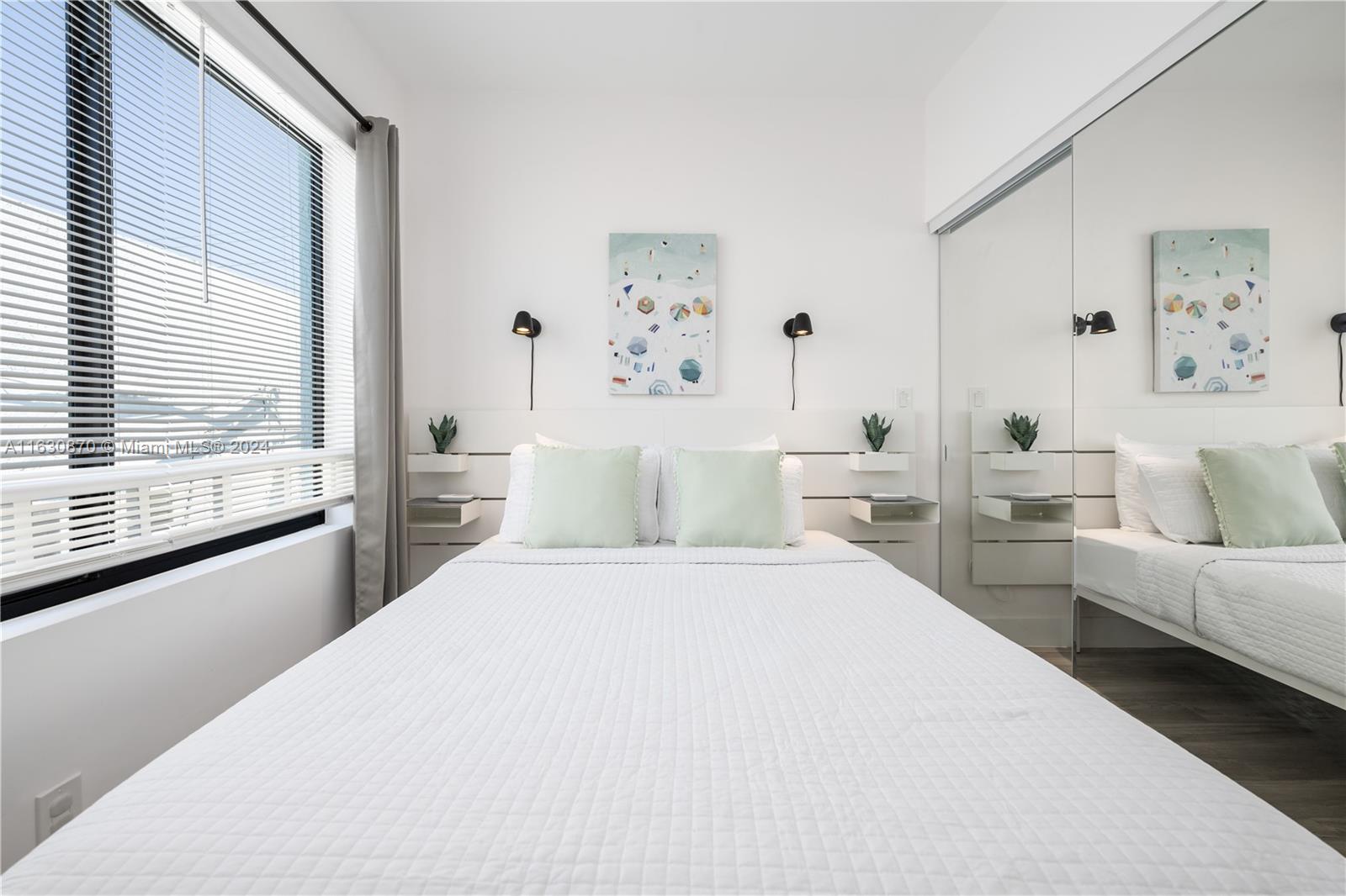 1648 Southwest 7th Street Miami, FL 33135 - Photo 20 of 23 a bedroom with a large bed and a couch