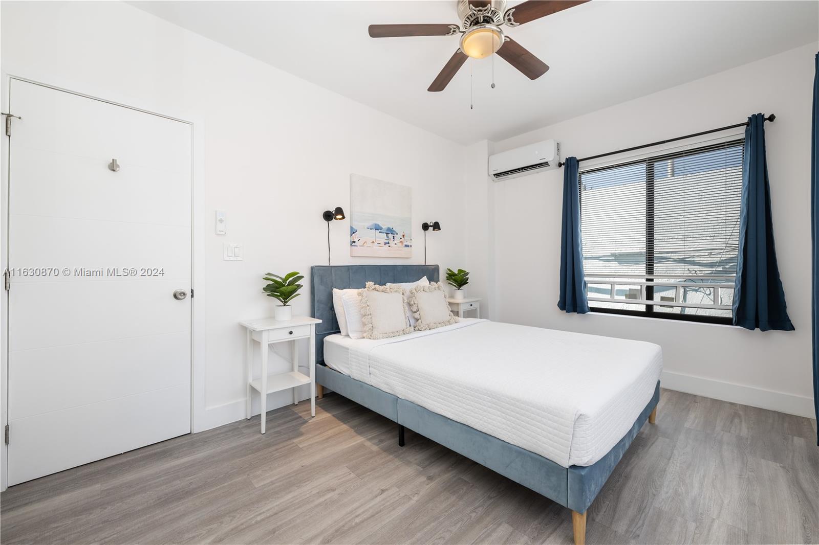 1648 Southwest 7th Street Miami, FL 33135 - Photo 22 of 23 a bedroom with a bed and window