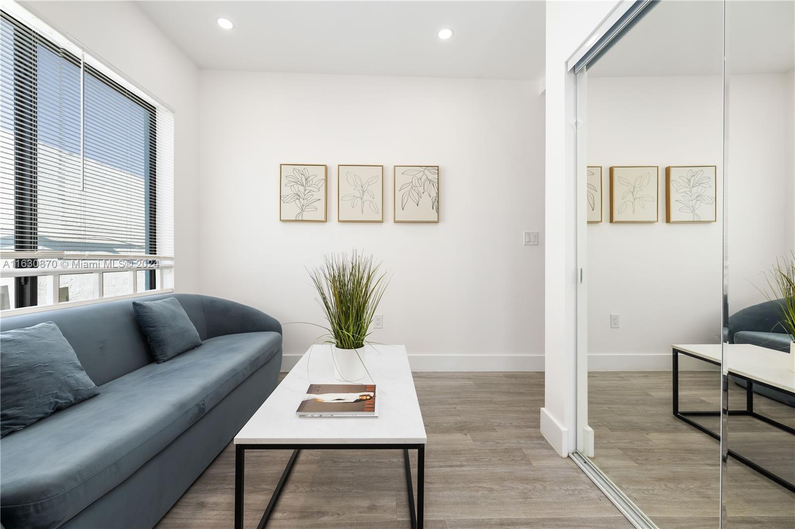1648 Southwest 7th Street Miami, FL 33135 - Photo 8 of 23 a living room with furniture and wooden floor