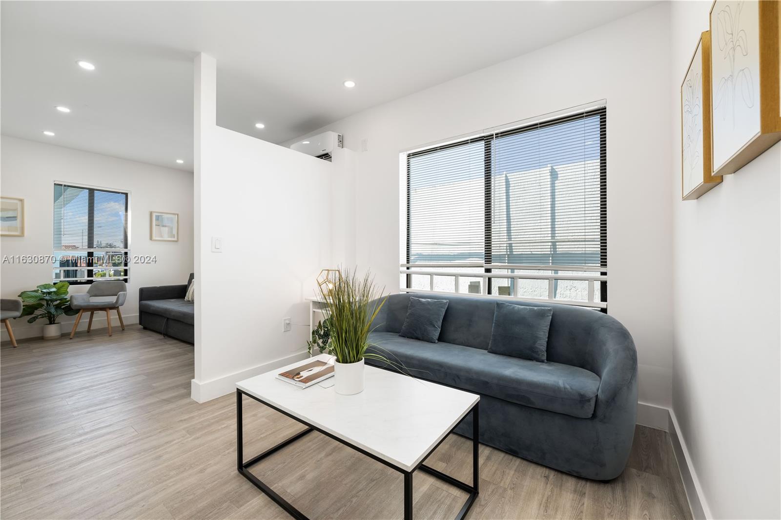 1648 Southwest 7th Street Miami, FL 33135 - Photo 9 of 23 a living room with furniture and a large window