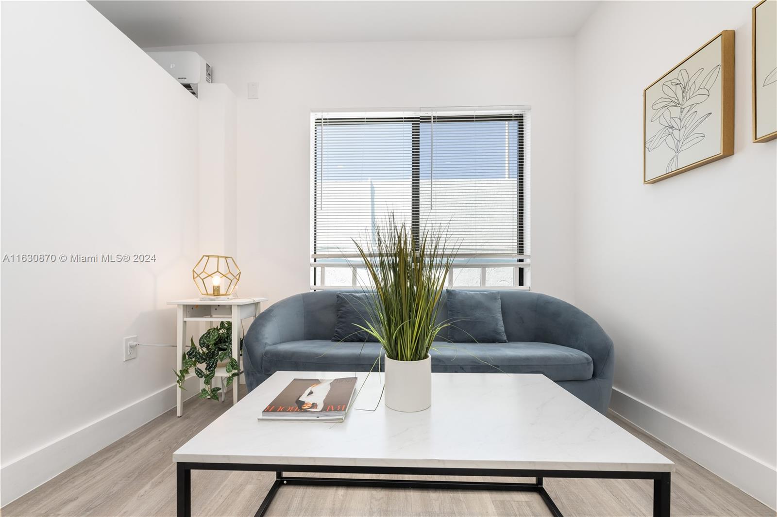 1648 Southwest 7th Street Miami, FL 33135 - Photo 10 of 23 a living room with furniture and a potted plant