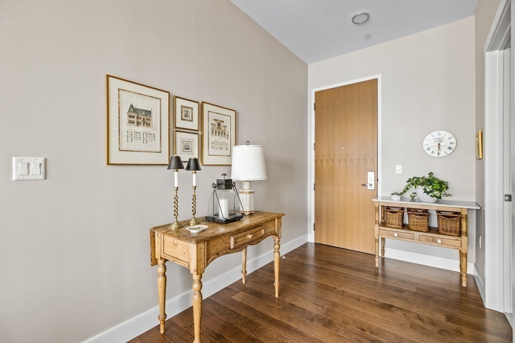 10 Shipyard Drive, Unit 408 Hingham, MA 02043 - Photo 17 of 26 a view of a workspace with furniture and wooden floor