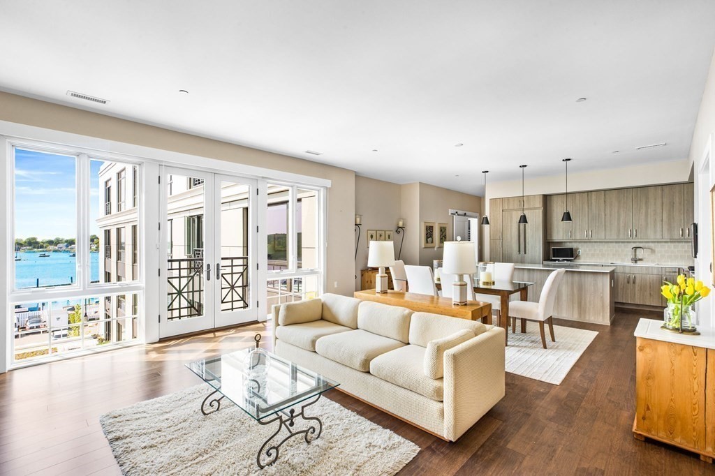 10 Shipyard Drive, Unit 408 Hingham, MA 02043 - Photo 2 of 26 a living room with furniture and a large window