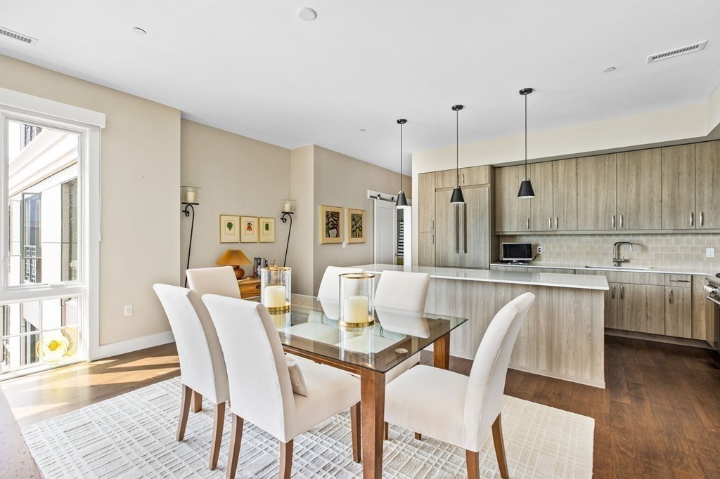10 Shipyard Drive, Unit 408 Hingham, MA 02043 - Photo 8 of 26 a view of a dining room with furniture and wooden floor