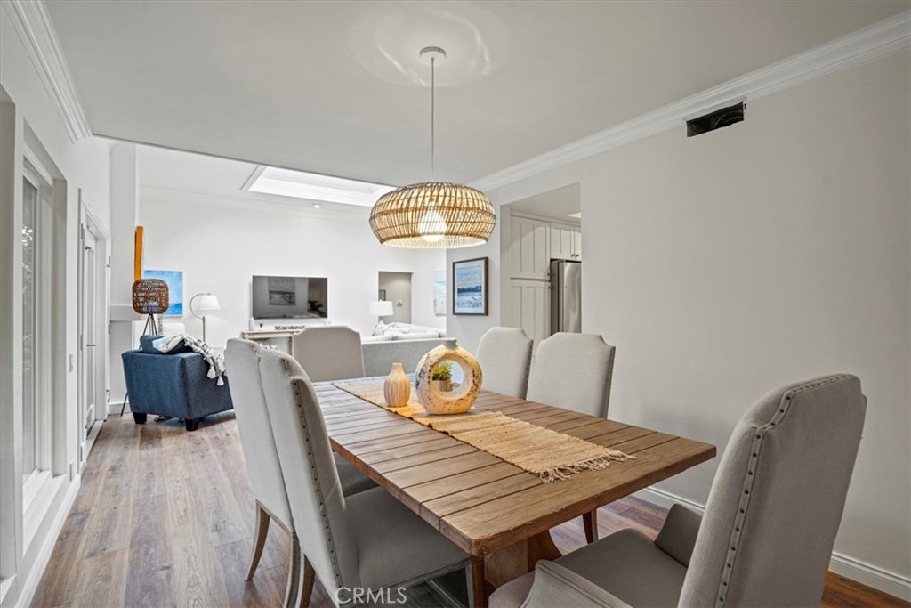 23802 Cassandra Bay Dana Point, CA 92629 - Photo 21 of 56 a view of a dining room with furniture window and wooden floor