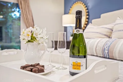 a spacious bathroom with a granite countertop sink and a mirror