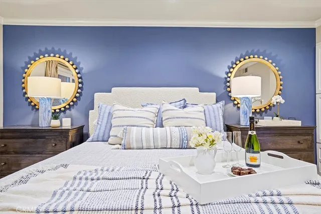 a spacious en suite bathroom with a granite countertop sink