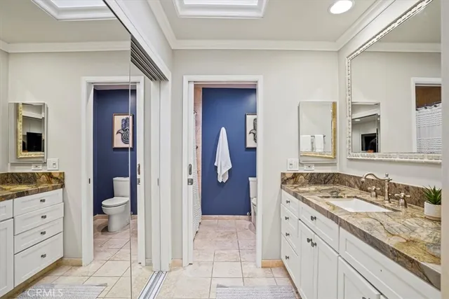 a bedroom with a bed and a mirror