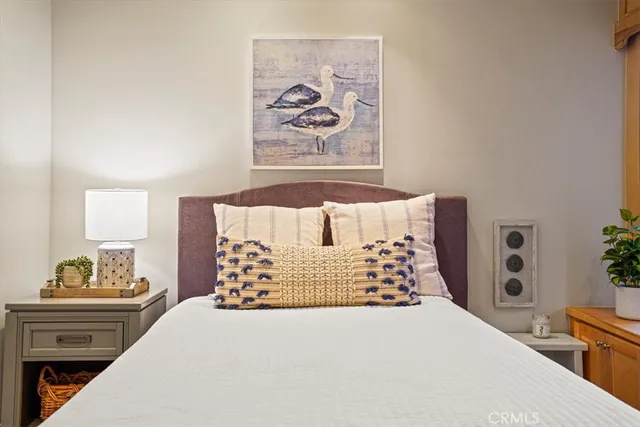 a bedroom with a bed and a cabinets