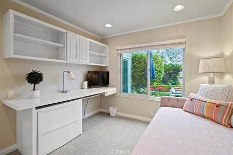 swimming pool view with a seating space