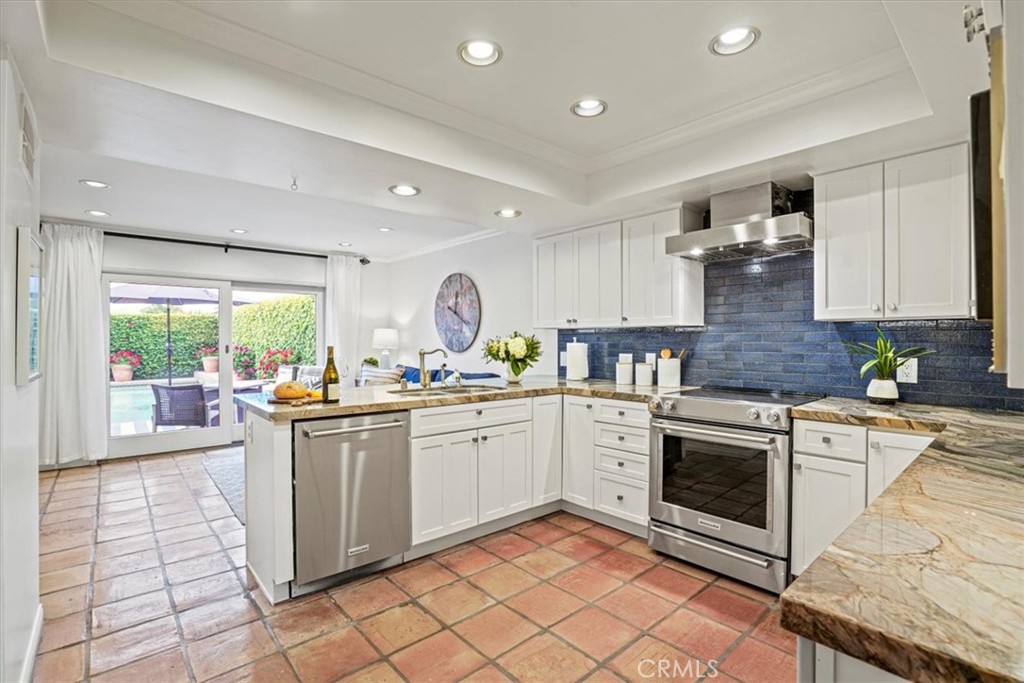 23802 Cassandra Bay Dana Point, CA 92629 - Photo 10 of 56 a kitchen with stainless steel appliances granite countertop a stove a sink and a refrigerator