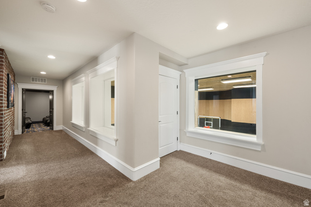 1205 North Elk Rdg Lane, Unit 202 Alpine, UT 84004 - Photo 50 of 88 Hallway featuring plush carpeting, recessed lighting, and a brick accent wall