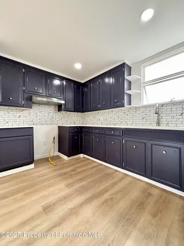 a kitchen with granite countertop a cabinets and a sink