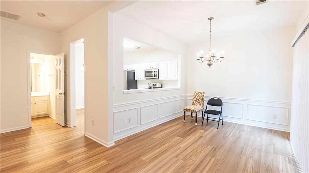 2070 Hailston Drive Northwest Duluth, GA 30097 - Photo 14 of 42 a living room with furniture and wooden floor
