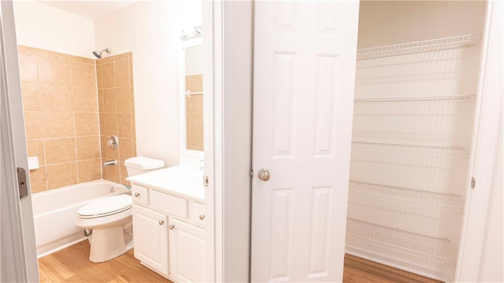 2070 Hailston Drive Northwest Duluth, GA 30097 - Photo 30 of 42 a white toilet sitting next to a bathroom sink