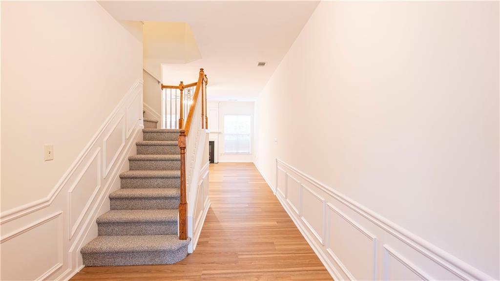 2070 Hailston Drive Northwest Duluth, GA 30097 - Photo 3 of 42 a view of a hallway with wooden floor and entryway